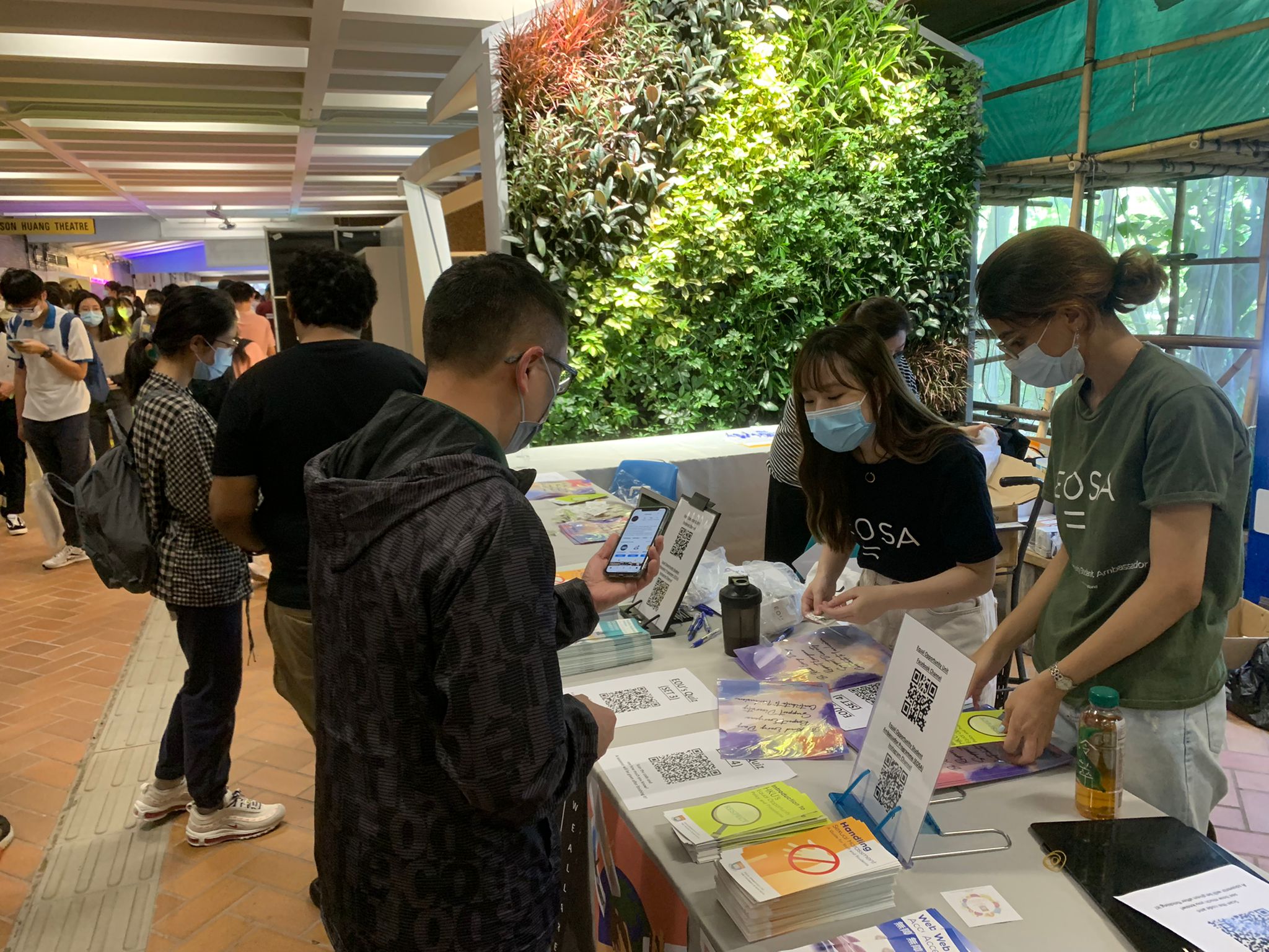 EOSAs interacting with visitors during HKU Information Day.