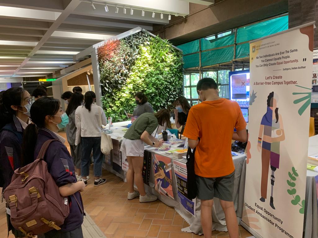 EOSAs interacting with visitors during HKU Information Day.