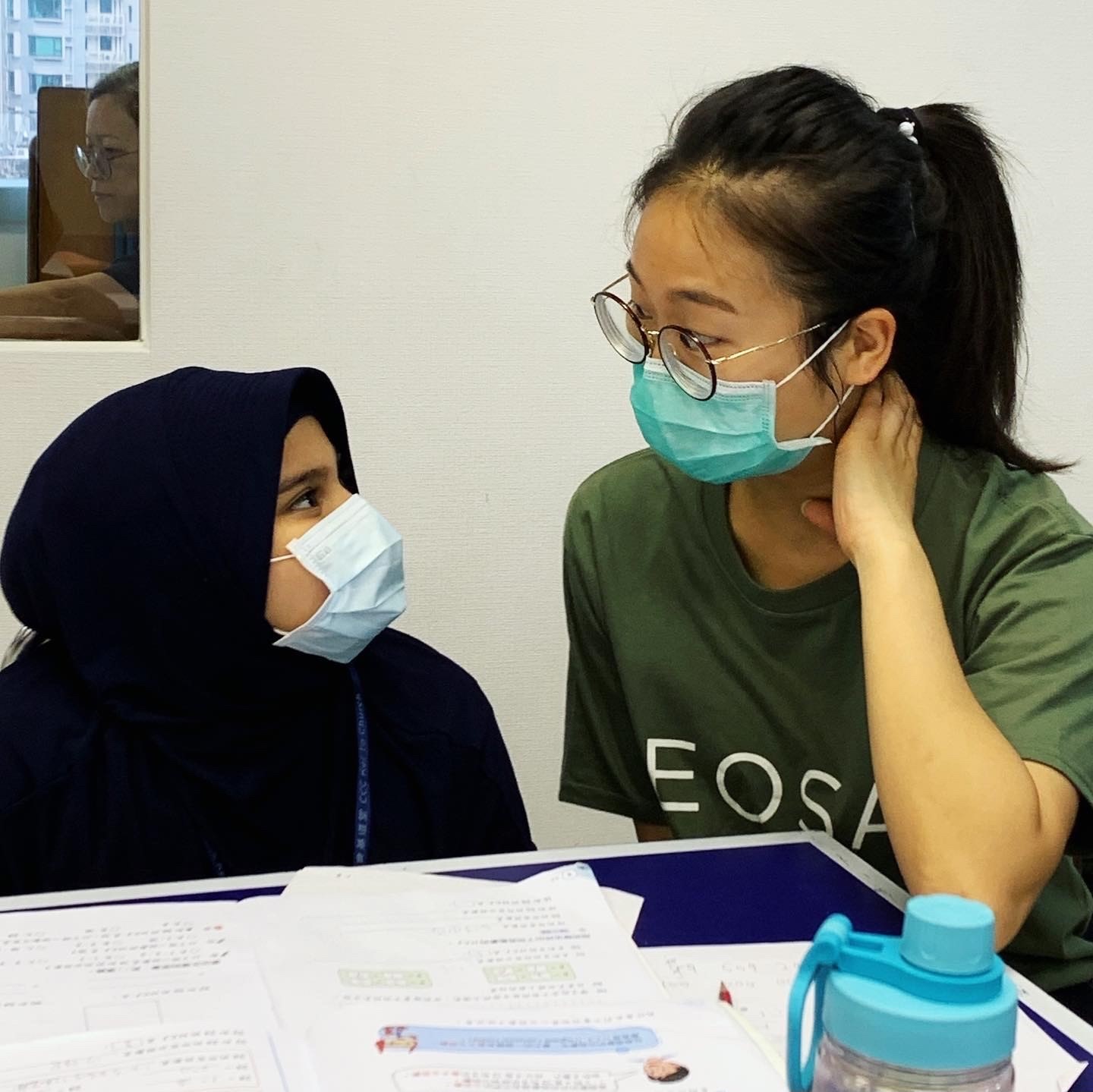 Photo of EOSA Service Day: a EOSA and a child
