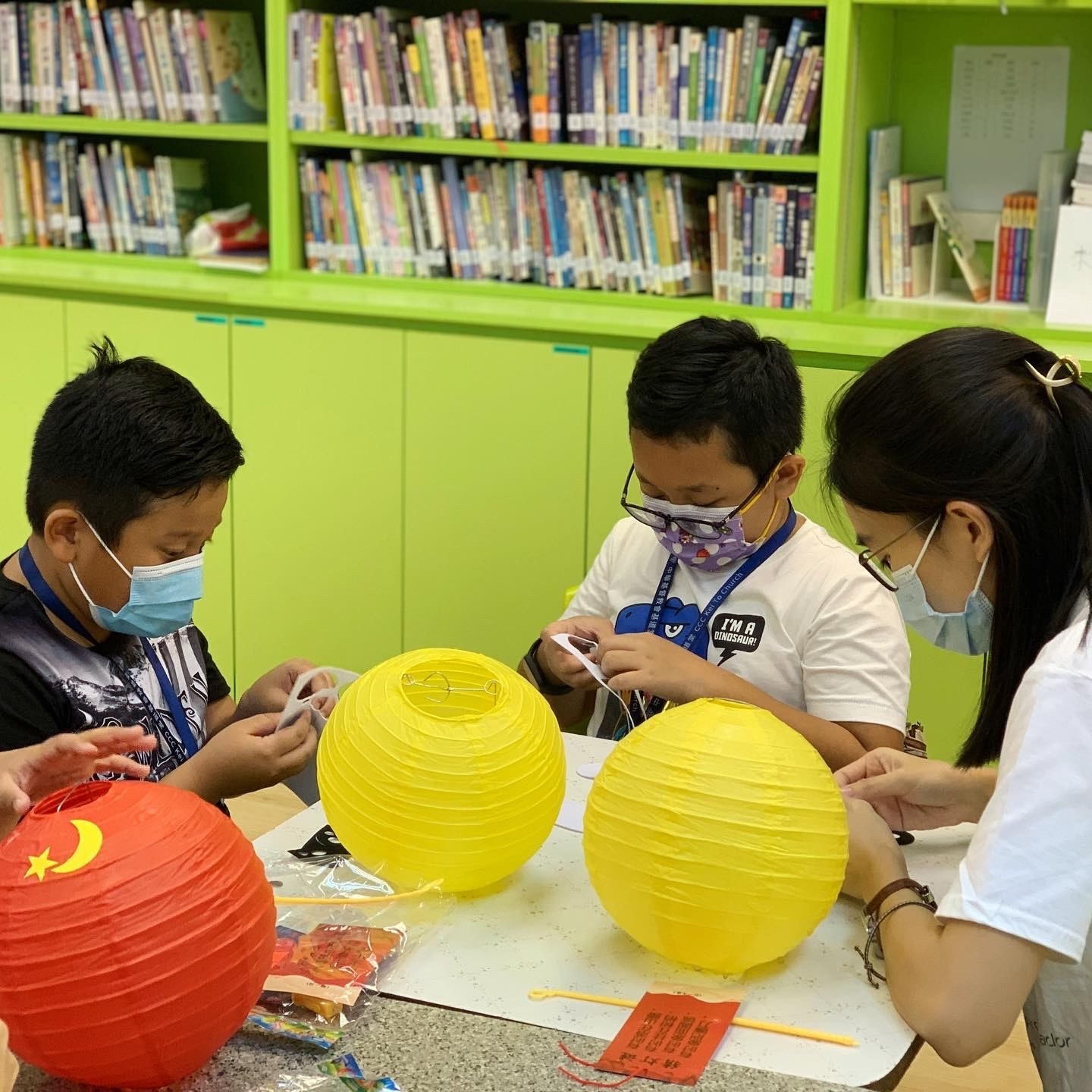 Photo of EOSA Service Day: One EOSA making lantern together with the children